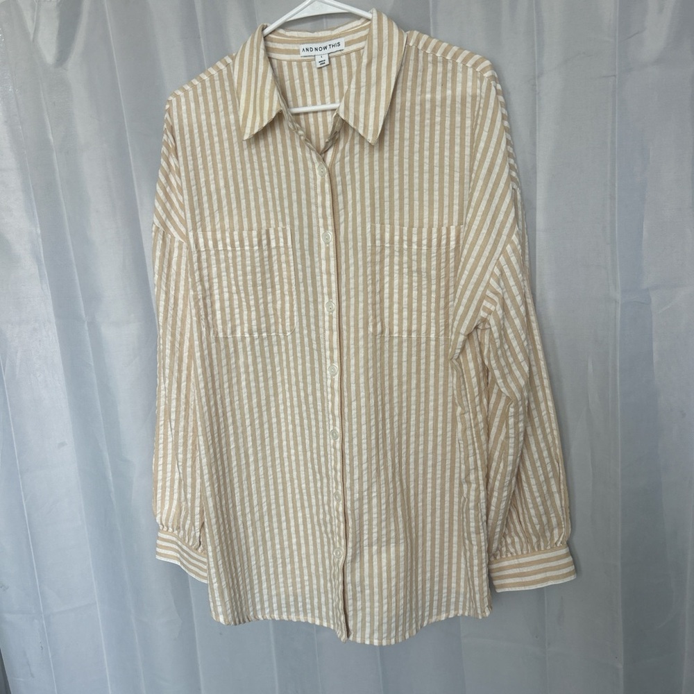 Tan and white striped women’s button up shirt. Size L